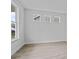 Living area with lots of natural light, light gray plank floors, and bright neutral walls at 747 Maynard Ln, Summerville, SC 29486