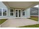 Covered patio with concrete flooring and large windows to the house's interior at 747 Maynard Ln, Summerville, SC 29486