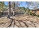 Large fenced backyard offers privacy, space for entertaining, and is shaded by mature trees, a great outdoor space at 7753 Linsley Dr, North Charleston, SC 29418