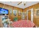 Dining area featuring wood paneling, a large table, and decorative wall art at 7753 Linsley Dr, North Charleston, SC 29418