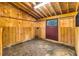 View of the barn stall highlighting the sturdy wooden construction and practical design at 7805 Seafield Rd, Yonges Island, SC 29449