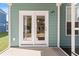 Inviting back porch with double doors offering a glimpse into the interior of the home at 804 S Pointe Blvd, Summerville, SC 29483