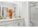 Bright bathroom featuring double sinks, white cabinetry, and a shower with tub at 804 S Pointe Blvd, Summerville, SC 29483