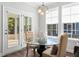Cozy dining area with french doors and a chandelier next to multiple windows at 804 S Pointe Blvd, Summerville, SC 29483