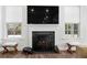 Inviting fireplace with white mantel, decorative fire screen, and flanking windows at 804 S Pointe Blvd, Summerville, SC 29483