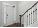 Bright foyer features a staircase with wood treads, white risers, and a charming white door at 804 S Pointe Blvd, Summerville, SC 29483
