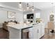 Bright, open kitchen boasts a large island, stainless steel appliances, and seamless flow into the living area at 804 S Pointe Blvd, Summerville, SC 29483