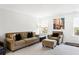 Well-lit living room with comfortable furniture and a window at 804 S Pointe Blvd, Summerville, SC 29483