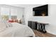 Bright and spacious main bedroom with large windows and a seating area that includes a TV at 804 S Pointe Blvd, Summerville, SC 29483