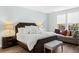 Comfortable main bedroom suite has natural light, a plush seating area and a dark wood trim bed at 804 S Pointe Blvd, Summerville, SC 29483