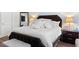 Comfortable main bedroom suite with natural light, nightstands and dark wood trim bed at 804 S Pointe Blvd, Summerville, SC 29483