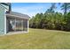 Spacious screened porch with views of the lush, green backyard, a perfect outdoor retreat at 804 S Pointe Blvd, Summerville, SC 29483