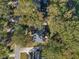 Aerial view of brick home with manicured landscaping and mature trees on a desirable corner lot at 8608 Wild Bird Ct, North Charleston, SC 29420