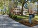 Well-maintained home featuring manicured landscaping, a long driveway, and a charming mailbox at 8608 Wild Bird Ct, North Charleston, SC 29420