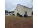 Large backyard with lawn, patio and sliding glass door of this two-story house at 9044 Greenbriar Dr, Summerville, SC 29485