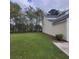 Large backyard with green grass and view of the side of the house at 9044 Greenbriar Dr, Summerville, SC 29485