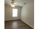 Bedroom with wood floors, a ceiling fan and a bright window at 9044 Greenbriar Dr, Summerville, SC 29485