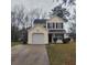Charming two-story home with yellow siding, black shutters, and a well-maintained front yard at 9044 Greenbriar Dr, Summerville, SC 29485