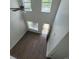 Open living area with hardwood floors and natural light from the windows at 9044 Greenbriar Dr, Summerville, SC 29485
