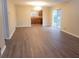 Spacious living room featuring hardwood flooring and a sliding glass door to backyard at 9044 Greenbriar Dr, Summerville, SC 29485