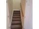Staircase with carpeted steps, leading to the upper level of the house at 9044 Greenbriar Dr, Summerville, SC 29485