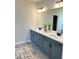 Bathroom featuring double sinks, gray cabinets, stylish fixtures, and modern decor at 1001 Middleton Dr Dr, Goose Creek, SC 29445