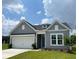 Charming one-story home with gray siding, a two-car garage, and a well-manicured front yard at 1001 Middleton Dr Dr, Goose Creek, SC 29445