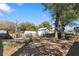 Large backyard featuring a storage shed, mature trees, and a wooden fence at 1014 Alamo St, North Charleston, SC 29405