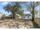 Expansive backyard with mature trees, a garage, and a newly constructed fence at 1014 Alamo St, North Charleston, SC 29405