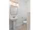 Contemporary bathroom with a pedestal sink, stylish mirror, and mosaic tile floors at 1014 Alamo St, North Charleston, SC 29405