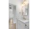 Elegant bathroom features a vanity with marble countertop, modern lighting, and gold fixtures for a luxurious feel at 1014 Alamo St, North Charleston, SC 29405