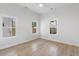 Bright bedroom with hardwood floors, a ceiling fan, and large windows offers natural light and comfort at 1014 Alamo St, North Charleston, SC 29405