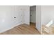 Spacious bedroom boasts pristine white walls, sleek hardwood floors, and ample closet space for easy storage at 1014 Alamo St, North Charleston, SC 29405