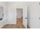 Bright bedroom features hardwood floors, white walls, trim, and a closet, offering a clean and modern aesthetic at 1014 Alamo St, North Charleston, SC 29405