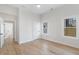 Bright bedroom with hardwood floors, white trim, and neutral walls offers a versatile and inviting space at 1014 Alamo St, North Charleston, SC 29405