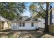 Charming home exterior showcasing crisp white siding and mature trees at 1014 Alamo St, North Charleston, SC 29405