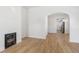 Open-concept living room features light wood floors, white walls and an archway to the kitchen at 1014 Alamo St, North Charleston, SC 29405