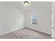 Bright bedroom featuring neutral carpeting, white walls and trim, and a window offering natural light at 1022 Drakeford St # 10P, Saint George, SC 29477