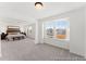 An open-concept bedroom featuring large windows, neutral carpeting, and lots of natural light at 1022 Drakeford St # 10P, Saint George, SC 29477