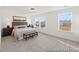 Spacious bedroom with large windows for ample natural light, carpeted floors, and stylish furniture at 1022 Drakeford St # 10P, Saint George, SC 29477