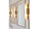 Elegant bathroom mirrors illuminated by modern sconces, reflecting a bright and airy atmosphere at 105 Peninsula Dr, Ravenel, SC 29470