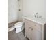 Tiled bathroom with walk-in shower, toilet, and vanity with solid surface counter at 105 Peninsula Dr, Ravenel, SC 29470