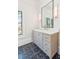 Bathroom vanity with a marble countertop, custom cabinetry, and stylish fixtures at 105 Peninsula Dr, Ravenel, SC 29470