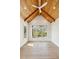 Bright bedroom with vaulted wood-paneled ceiling, hardwood floors, and large windows overlooking the landscaped yard at 105 Peninsula Dr, Ravenel, SC 29470