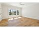 Spacious bedroom with hardwood floors, large windows, and a ceiling fan at 105 Peninsula Dr, Ravenel, SC 29470