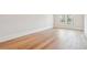 Bright bedroom with light hardwood floors and a window with a view of the outdoors at 105 Peninsula Dr, Ravenel, SC 29470