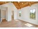 Bright bedroom with vaulted wood-paneled ceiling, hardwood floors, an ensuite bath and large windows at 105 Peninsula Dr, Ravenel, SC 29470