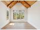 Bright bedroom with vaulted wood-paneled ceiling, hardwood floors, and large windows at 105 Peninsula Dr, Ravenel, SC 29470