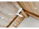Unique vaulted ceiling made from a light colored wood paneling and a modern, sleek ceiling fan at 105 Peninsula Dr, Ravenel, SC 29470