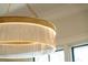 Close-up of a gold chandelier with glass slats at 105 Peninsula Dr, Ravenel, SC 29470